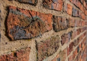 Red brick wall Photo by Alex McSorley